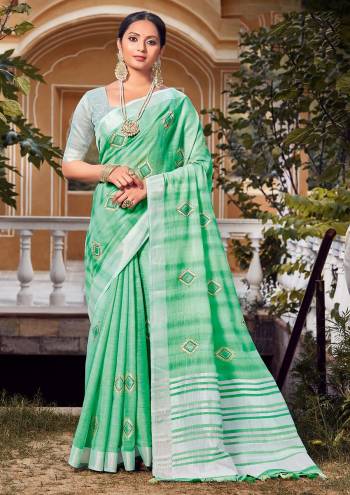 Looking This Traditional Saree Are Fine Saree Paired With Blouse.This Saree And Blouse Are Linen Based Fabric With Heavy Wevon Designer Work. Buy This Pretty Saree Now.