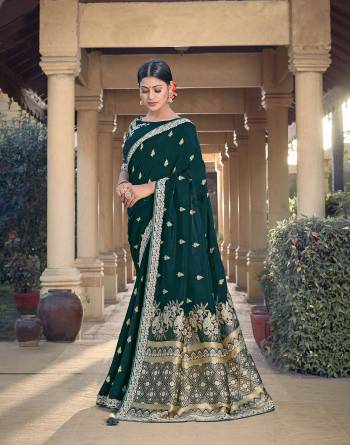 Looking This Traditional Partywear Saree Are Fine Saree Paired With Contrasted Blouse.This Saree Are Viscose Silk And Blouse Are Raw Silk Fabric With Heavy Weaving Designer And Embroidery Work. Buy This Pretty Saree Now.