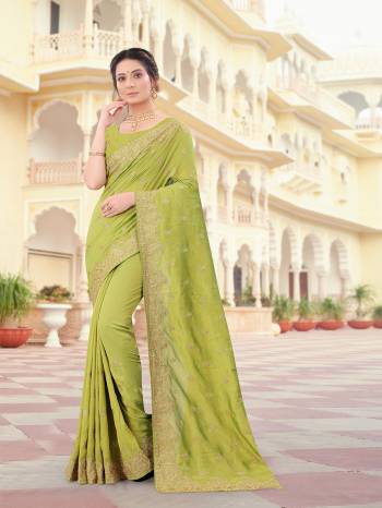 Attrective Look This Traditionl Partywear Saree Are Fine Saree Paired With Blouse.This Saree And Blouse Are Two Tone Vichitra Silk Based Fabric With Heavy Designer Jari Embroidery,Stone Work. Buy This Pretty Saree Now.