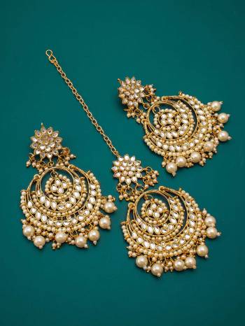 Attrective An Enhanced Look To Your Personality By Pairing Up This Beautiful Maangtikka With Your Ethnic Attire. This Pretty Set Is In Gold Color Beautified With Kundan Work. Buy Now.