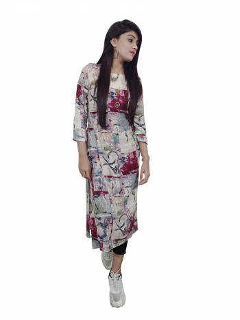 Garb This Readymade Long Kurti In Fine Color Fabricated On Rayon Beautified With Designer Printed. It Is Light In Weight And Easy To Carry All Day Long. 