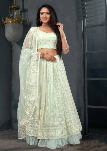 Attrective Heavy Designer Lehenga Choli In Fine Color Fabricated On Net And Dupatta Are Net Beautified With Heavy Attractive Lukhnawi Embroidery Work. 