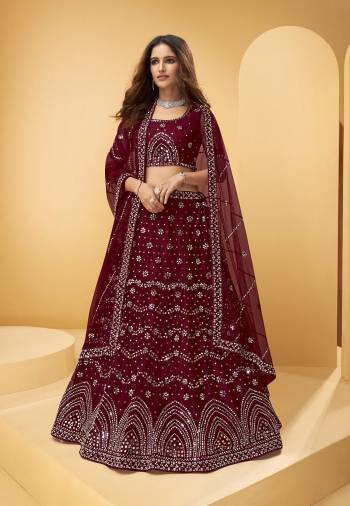 Garb This Wedding Partywear Heavy Designer Lehenga Choli And Dupatta In Fancy Color Fabricated On Net Beautified With Butterfly Net Dupatta And Heavy Attractive Thread,Mirror Embroidery With Zarkan Work. 