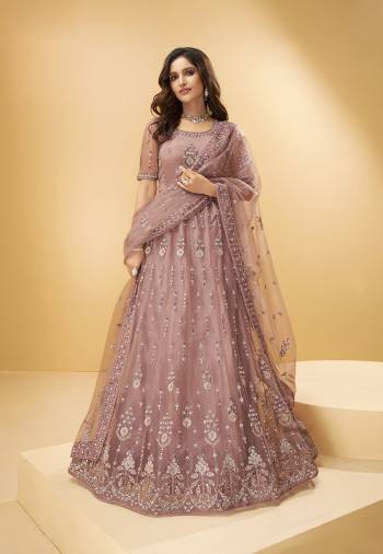 Garb This Wedding Partywear Heavy Designer Lehenga Choli And Dupatta In Fancy Color Fabricated On Net Beautified With Butterfly Net Dupatta And Heavy Attractive Thread,Mirror Embroidery With Zarkan Work. 