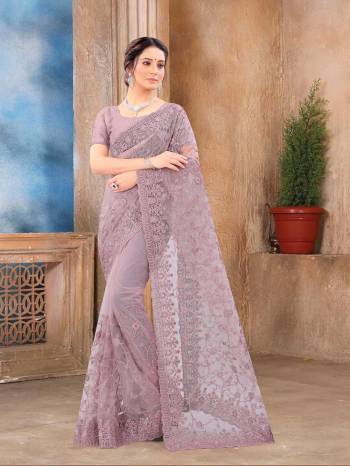 Attrective Look This Fastival Partywear Saree Are Fine Saree Paired With Blouse.This Saree And Blouse Are Net Based Fabric With Heavy Designer Reshan And Coding Embroidery,Zarkan Stone Work. Buy This Pretty Saree Now.