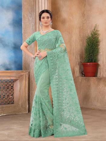 Attrective Look This Fastival Partywear Saree Are Fine Saree Paired With Blouse.This Saree And Blouse Are Net Based Fabric With Heavy Designer Reshan And Coding Embroidery,Zarkan Stone Work. Buy This Pretty Saree Now.