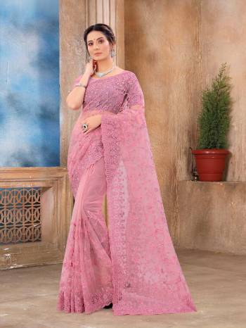 Attrective Look This Fastival Partywear Saree Are Fine Saree Paired With Blouse.This Saree And Blouse Are Net Based Fabric With Heavy Designer Reshan And Coding Embroidery,Zarkan Stone Work. Buy This Pretty Saree Now.