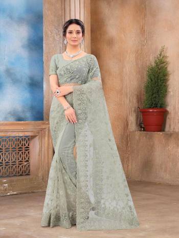 Attrective Look This Fastival Partywear Saree Are Fine Saree Paired With Blouse.This Saree And Blouse Are Net Based Fabric With Heavy Designer Reshan And Coding Embroidery,Zarkan Stone Work. Buy This Pretty Saree Now.