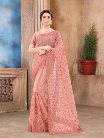 Attrective Look This Fastival Partywear Saree Are Fine Saree Paired With Blouse.This Saree And Blouse Are Net Based Fabric With Heavy Designer Reshan And Coding Embroidery,Zarkan Stone Work. Buy This Pretty Saree Now.