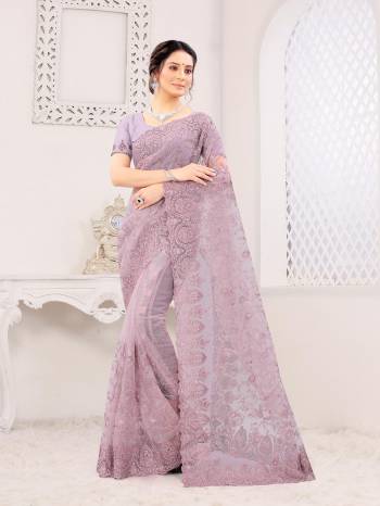 Attrective Look This Fastival Partywear Saree Are Fine Saree Paired With Blouse.This Saree And Blouse Are Net Based Fabric With Heavy Designer Reshan And Coding Embroidery,Zarkan Stone Work. Buy This Pretty Saree Now.