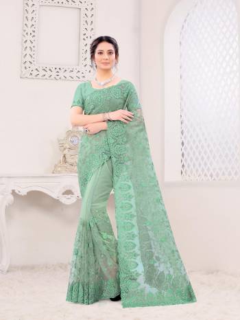 Attrective Look This Fastival Partywear Saree Are Fine Saree Paired With Blouse.This Saree And Blouse Are Net Based Fabric With Heavy Designer Reshan And Coding Embroidery,Zarkan Stone Work. Buy This Pretty Saree Now.