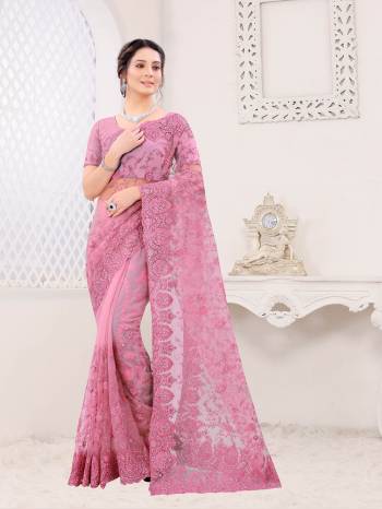 Attrective Look This Fastival Partywear Saree Are Fine Saree Paired With Blouse.This Saree And Blouse Are Net Based Fabric With Heavy Designer Reshan And Coding Embroidery,Zarkan Stone Work. Buy This Pretty Saree Now.