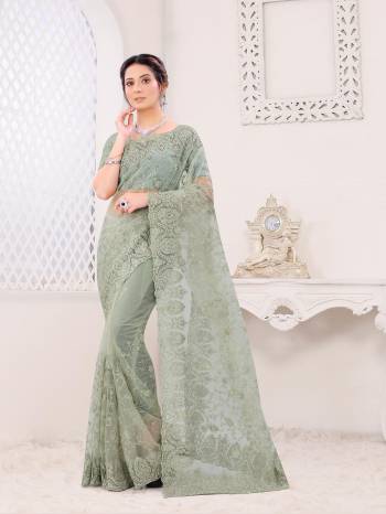 Attrective Look This Fastival Partywear Saree Are Fine Saree Paired With Blouse.This Saree And Blouse Are Net Based Fabric With Heavy Designer Reshan And Coding Embroidery,Zarkan Stone Work. Buy This Pretty Saree Now.