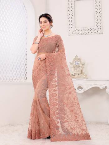 Attrective Look This Fastival Partywear Saree Are Fine Saree Paired With Blouse.This Saree And Blouse Are Net Based Fabric With Heavy Designer Reshan And Coding Embroidery,Zarkan Stone Work. Buy This Pretty Saree Now.