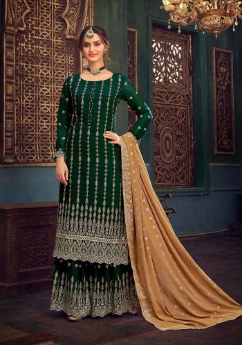 Attrective Look This Designer Long Length Suit In Lovely Color.Its Pretty Heavy Designer Embroidery,Swarovski Metal Hand Work Top Is Georgette Based Paired With Santoon Bottom And Georgette Fabricated Dupatta Which Gives An Attractive To The Suit.