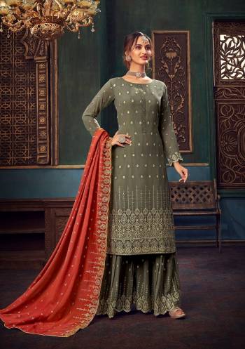 Attrective Look This Designer Long Length Suit In Lovely Color.Its Pretty Heavy Designer Embroidery,Swarovski Metal Hand Work Top Is Georgette Based Paired With Santoon Bottom And Georgette Fabricated Dupatta Which Gives An Attractive To The Suit.