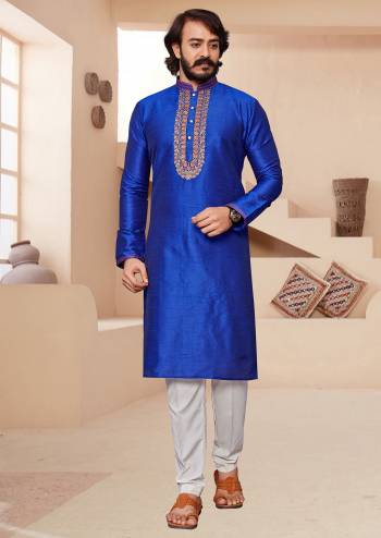 Take your ethnic style quotient to the next level by wearing this fashionable. Tailored Kurta Pajama  finest Art Silk fabric With Embroidery Work and fashioned with a banded collar for a dash of style.