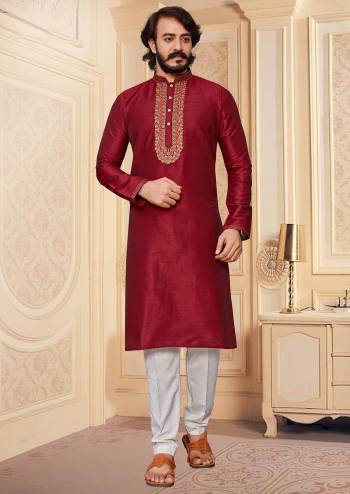 Take your ethnic style quotient to the next level by wearing this fashionable. Tailored Kurta Pajama  finest Art Silk fabric With Embroidery Work and fashioned with a banded collar for a dash of style.