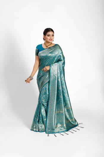 Garb This Partywear Saree Are Fine Saree Paired With Blouse.This Saree And Blouse Are Tanchoi Silk Based Fabric With Heavy Jacquard Designer Work. Buy This Pretty Saree Now.