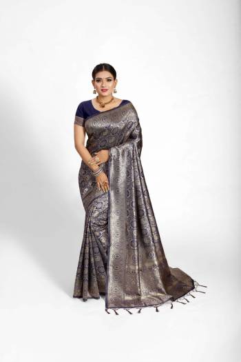 Garb This Partywear Saree Are Fine Saree Paired With Blouse.This Saree And Blouse Are Tanchoi Silk Based Fabric With Heavy Jacquard Designer Work. Buy This Pretty Saree Now.