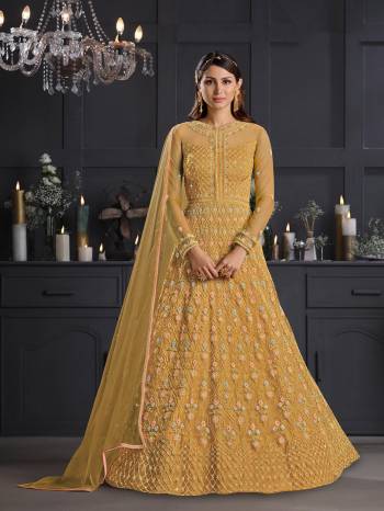 Attrective This Partywear Designer Long Suits In Lovely Fine Color.?Its Pretty Designer Thread Embroidery Work Top Is Butterfly Net Based Paired Bottom Satin With Batterfly Net Fabricated Dupatta Which Gives An Attractive To The Dress.