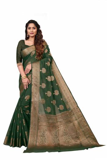 Garb This Stylist Saree Are Fine Saree Paired With Blouse.This Saree And Blouse Are Banarasi Cotton Fabric With Designer Wevon Jacquard. Buy This Pretty Saree Now.