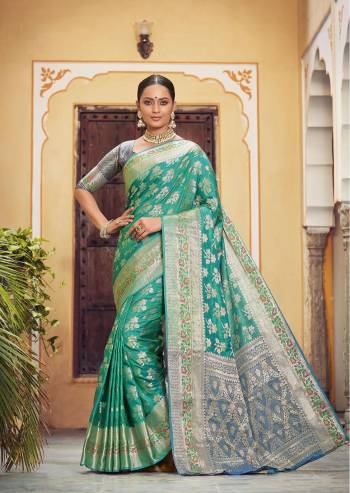 Looking This Traditional Partywear Saree Are Fine Saree Paired With Contrasted Blouse.This Saree And Blouse Are Banarasi Silk Based Fabric With Designer Weaving Work. Buy This Pretty Saree Now.