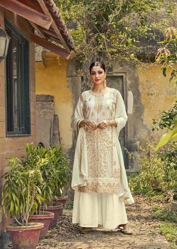 Attrective This Designer Long Length Suit In Lovely Color.Its Pretty Heavy Designer Embroidery With Stone Work Top Is Faux Georgette Based Paired With Santoon Bottom And Nazlin Fabricated Dupatta Which Gives An Attractive To The Suit.