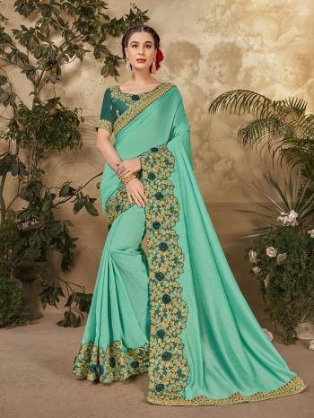 Grab This Pretty Elegant Looking Designer Saree In Fine Color Paired With Blouse. This Saree And Blouse Are Vichitra Silk Based Beautified With Embroidery Peaich And Blouse Work. Buy Now.