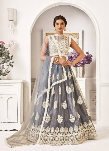 Garb This Partywear Heavy Designer Lehenga Choli And Dupatta In Fine Color Fabricated On Blouse Mono Net And Lahenga And Dupatta Are Mono Net Beautified With Heavy Attractive Work. 