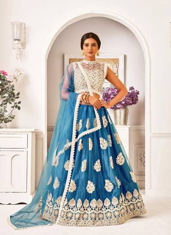 Garb This Partywear Heavy Designer Lehenga Choli And Dupatta In Fine Color Fabricated On Blouse Mono Net And Lahenga And Dupatta Are Mono Net Beautified With Heavy Attractive Work. 
