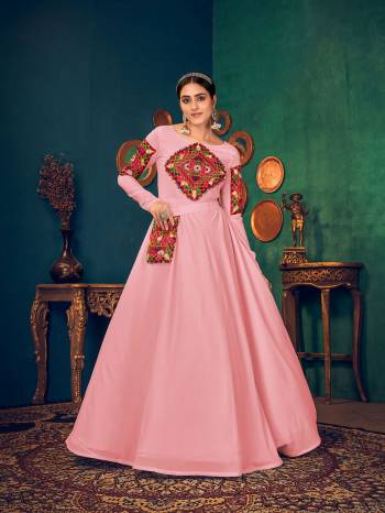 Flaunt Your Rich And Elegant Taste Wearing This Designer Long Gown In Light Color. This Pretty Gown Is Fabricated On Georgette Beautified With Real Mirror,Embroidery And Pearl Work. Its Fabric Is Soft Towards Skin And Easy To Carry All Day Long. 