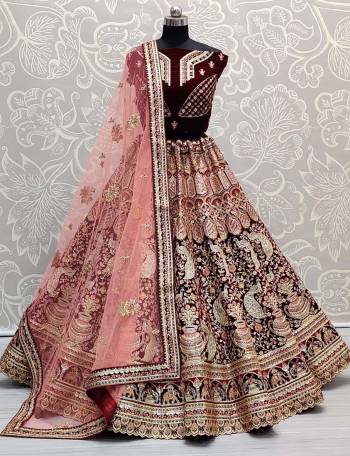 Look Attrective This Wedding Partywear Heavy Designer Lehenga Choli And Dupatta In Fine Color Fabricated On Velvet Beautified With Heavy Attractive Dori,Thread Embroidery Work. 