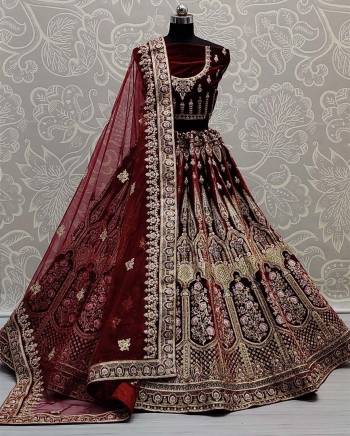 Look Attrective This Wedding Partywear Heavy Designer Lehenga Choli And Dupatta In Fine Color Fabricated On Velvet Beautified With Heavy Attractive Dori,Thread Embroidery Work. 