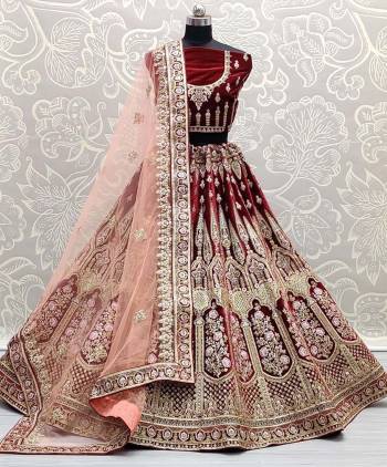 Look Attrective This Wedding Partywear Heavy Designer Lehenga Choli And Dupatta In Fine Color Fabricated On Velvet Beautified With Heavy Attractive Dori,Thread Embroidery Work. 