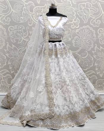 Attrective This Wedding Partywear Heavy Designer Lehenga Choli And Dupatta In Fine Color Fabricated On Net Beautified With Heavy Attractive Designer Embroidery Work. 