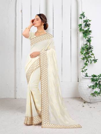 Garb This Partywear Saree Are Fine Saree Paired With Blouse.This Saree And Blouse Are Two Tone Vichitra Silk Fabric With Heavy Designer Embroidery And Border Stone Work. Buy This Pretty Saree Now.