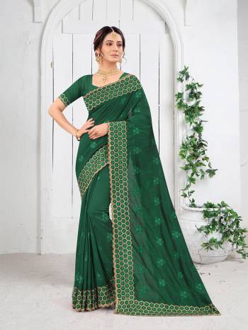 Garb This Partywear Saree Are Fine Saree Paired With Blouse.This Saree And Blouse Are Two Tone Vichitra Silk Fabric With Heavy Designer Embroidery And Border Stone Work. Buy This Pretty Saree Now.