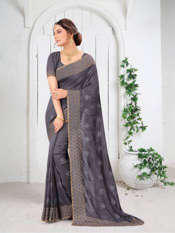 Garb This Partywear Saree Are Fine Saree Paired With Blouse.This Saree And Blouse Are Two Tone Vichitra Silk Fabric With Heavy Designer Embroidery And Border Stone Work. Buy This Pretty Saree Now.