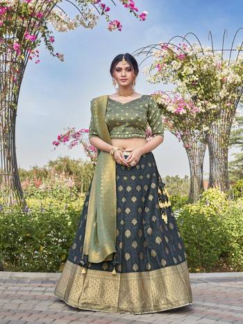 Garb This Partywear Designer Lehenga Choli And Dupatta In Fine Color Fabricated On Silk Beautified Fabric With Heavy Designer Weaving Butti Border Work. 