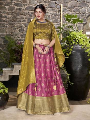 Garb This Partywear Designer Lehenga Choli And Dupatta In Fine Color Fabricated On Silk Beautified Fabric With Heavy Designer Weaving Butti Border Work. 