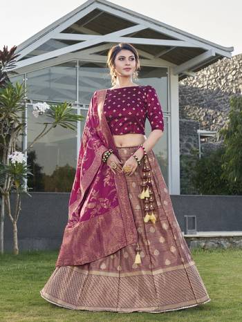 Garb This Partywear Designer Lehenga Choli And Dupatta In Fine Color Fabricated On Silk Beautified Fabric With Heavy Designer Weaving Butti Border Work. 
