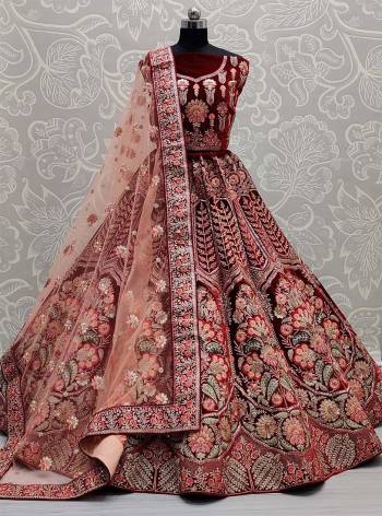 Look Attrective This Bridel Wedding Partywear Heavy Designer Lehenga Choli And Dupatta In Fine Color Fabricated On Velvet Beautified With Heavy Attractive Dori,Thread,Jari Embroidery With Zarkan Hand Work. 