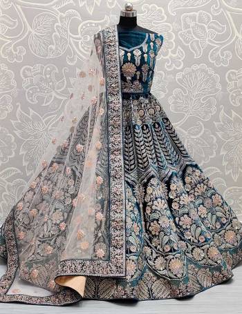 Look Attrective This Bridel Wedding Partywear Heavy Designer Lehenga Choli And Dupatta In Fine Color Fabricated On Velvet Beautified With Heavy Attractive Dori,Thread,Jari Embroidery With Zarkan Hand Work. 