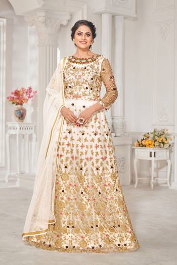 Garb This Designer Long Length Suit In Lovely Color.Its Pretty Heavy Designer Thread,Jari Embroidery Work Top Is Net Based Paired With Silk Bottom And Net Fabricated Dupatta Which Gives An Attractive To The Suit.