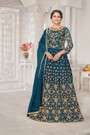 Garb This Designer Long Length Suit In Lovely Color.Its Pretty Heavy Designer Thread,Jari Embroidery Work Top Is Net Based Paired With Silk Bottom And Net Fabricated Dupatta Which Gives An Attractive To The Suit.