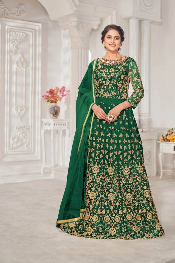 Garb This Designer Long Length Suit In Lovely Color.Its Pretty Heavy Designer Thread,Jari Embroidery Work Top Is Net Based Paired With Silk Bottom And Net Fabricated Dupatta Which Gives An Attractive To The Suit.