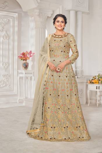 Garb This Designer Long Length Suit In Lovely Color.Its Pretty Heavy Designer Thread,Jari Embroidery Work Top Is Net Based Paired With Silk Bottom And Net Fabricated Dupatta Which Gives An Attractive To The Suit.