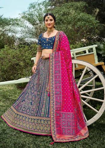 Look Attrective This Wedding Partywear Heavy Designer Lehenga Choli And Dupatta In Fine Color Fabricated On Silk Beautified With Heavy Attractive Wevon Designer,Embroidery,Stone Hand Work. 