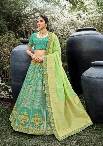 Look Attrective This Wedding Partywear Heavy Designer Lehenga Choli And Dupatta In Fine Color Fabricated On Silk Beautified With Heavy Attractive Wevon Designer,Embroidery,Stone Hand Work. 